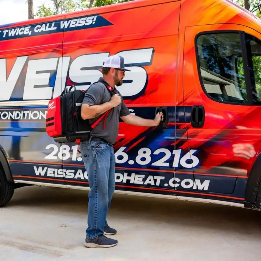 Weiss AC and Plumbing tech closing van to go to a job