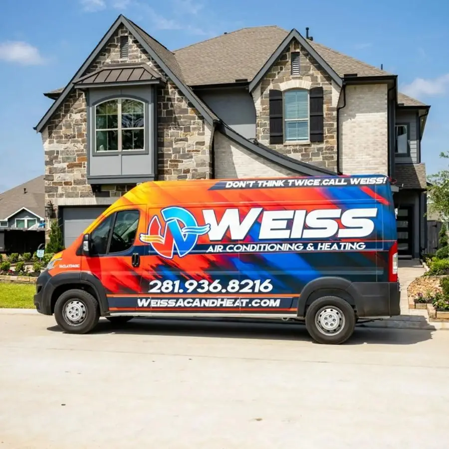 Weiss AC & Plumbing van is parked outside a residential home in Montgomery County, TX.