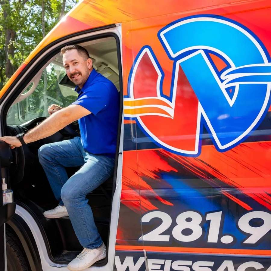 Nick Weiss getting out of a company van.