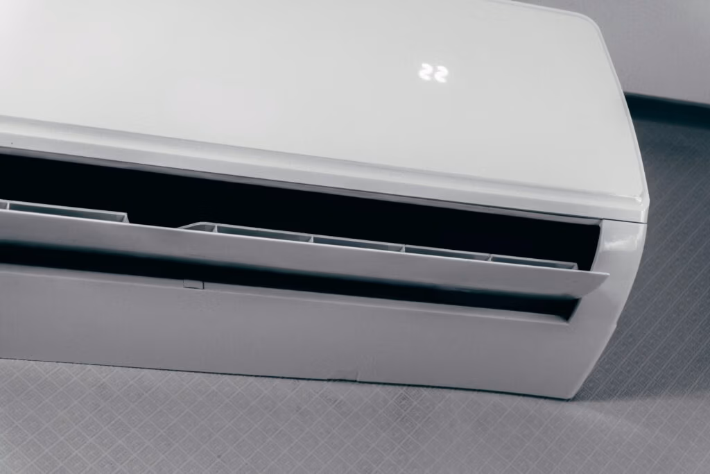 Professional installation of a wall-mounted ductless mini-split unit in a Magnolia home office for energy-efficient cooling.