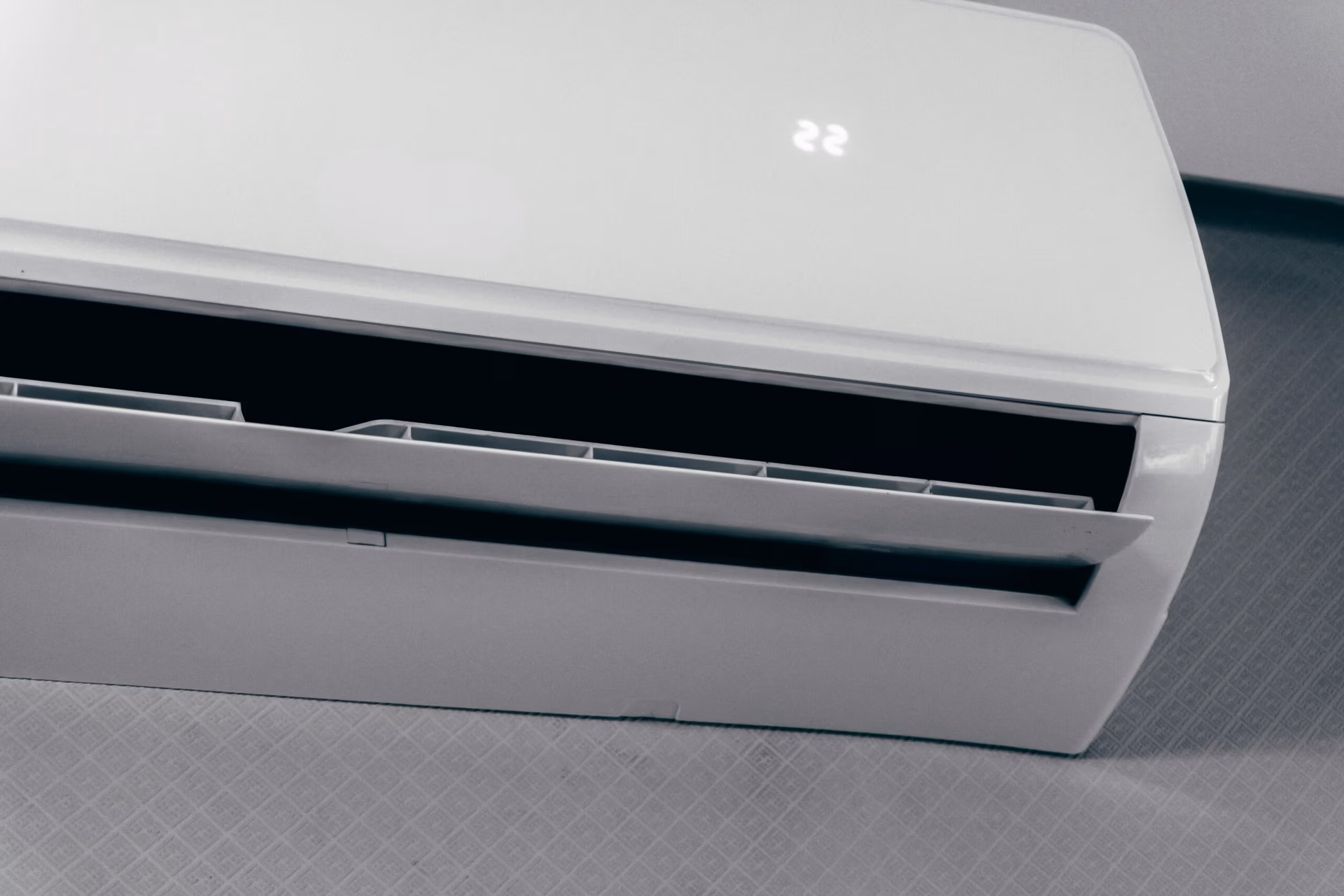 Professional installation of a wall-mounted ductless mini-split unit in a Magnolia home office for energy-efficient cooling.